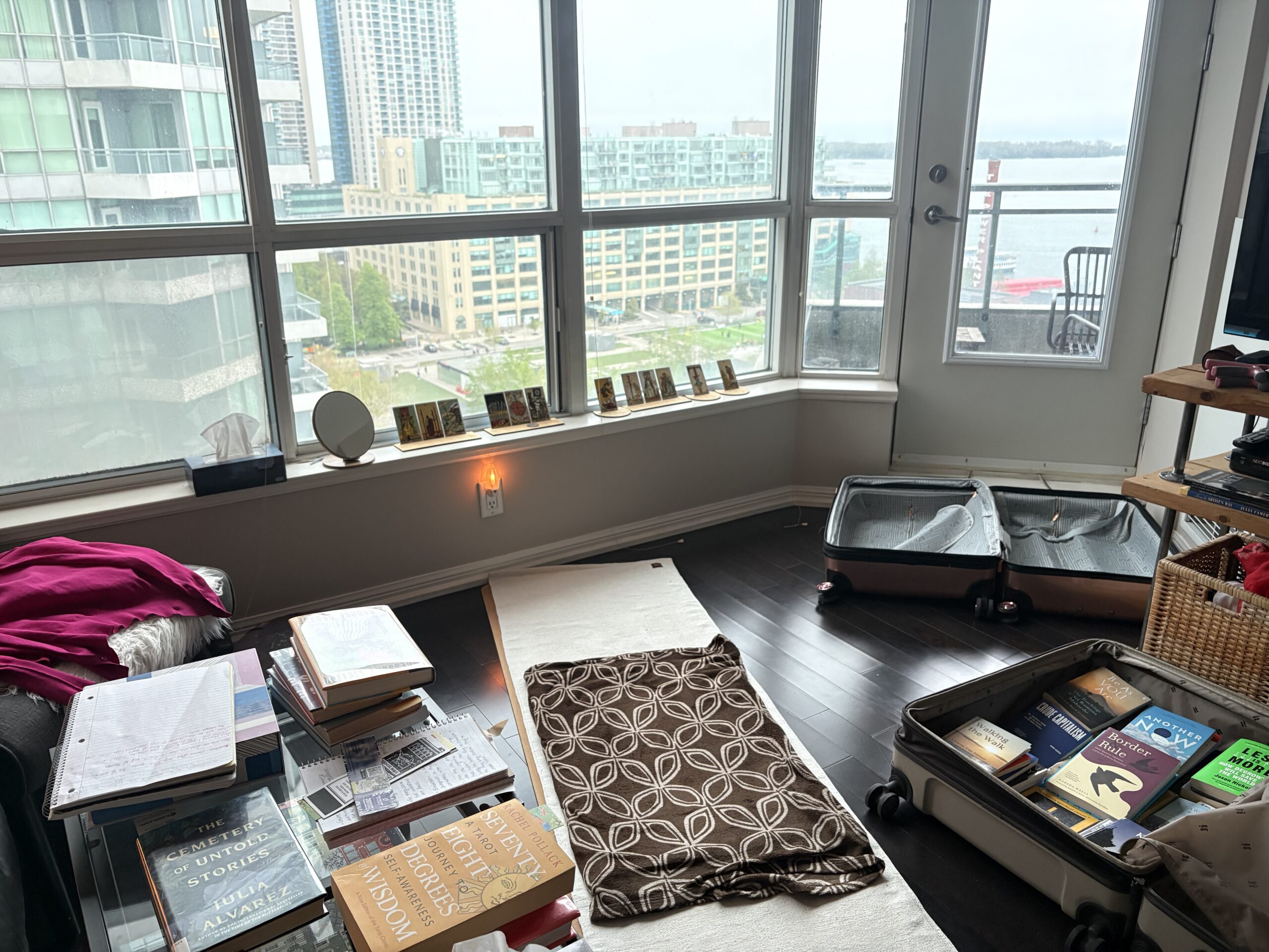 Living room with open suitcases on the floor
